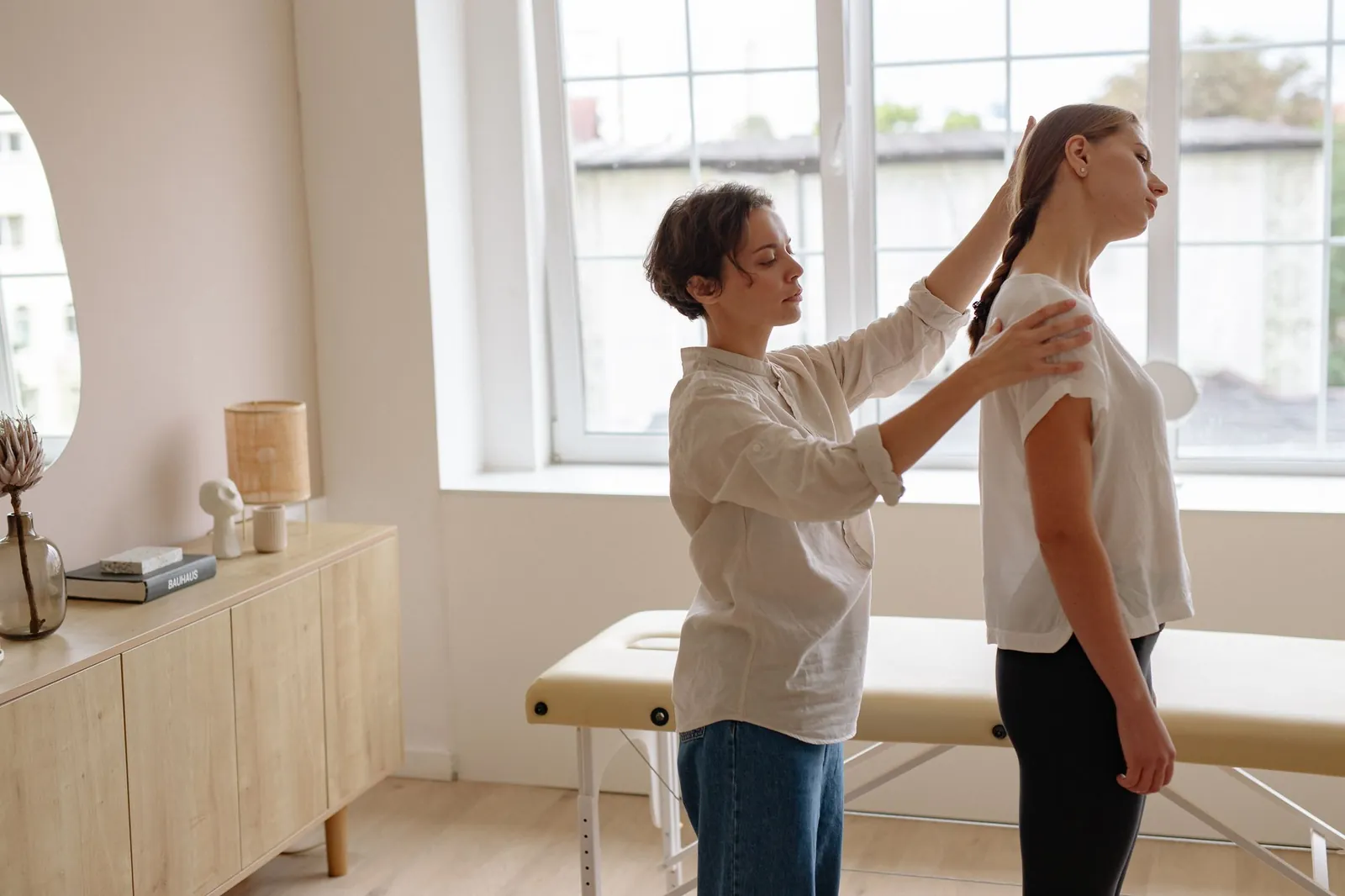 Therapist assessing a patient’s posture